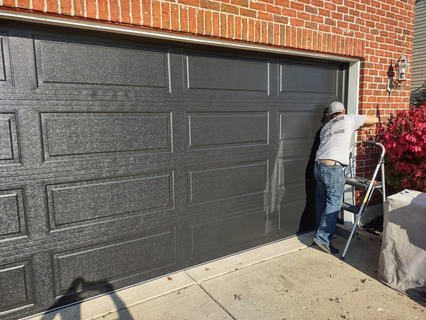 Superior Door technician working on a residential garage door